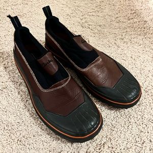 Clarks black & brown waterproof slip on rain/mud shoes.  Like new. Size 7.